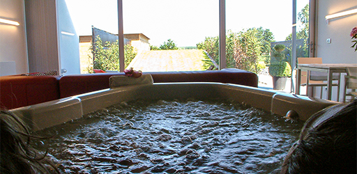 Uitzicht vanuit het massagebad van de Relax's Sauna -en Wellness Suite